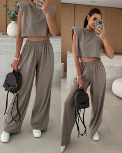 Elegant two-piece set featuring padded shoulder sleeveless top and matching wide-leg trousers