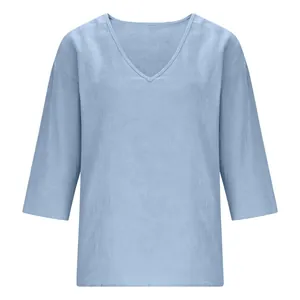 Front view detail of a light blue casual V-neck slub cotton blouse for women
