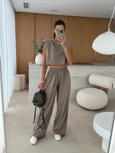 Modern 2-piece set featuring a padded shoulder sleeveless top and wide-leg trousers