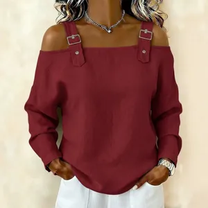 Elegant wine red cold shoulder long sleeve top featuring stylish silver buckle strap details