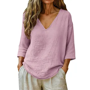 Close-up of casual pink V-neck women's top featuring breathable slub cotton texture