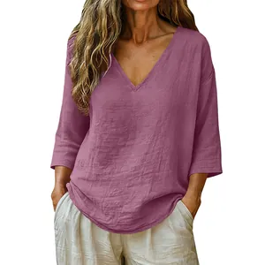 Detail view of mauve slub cotton blouse featuring a loose fit V-neck and 3/4 sleeves