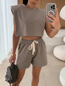 Chic taupe two-piece summer set with padded shoulder sleeveless top and drawstring shorts