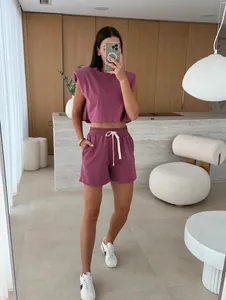 Full view of women's mauve lounge set with padded shoulder sleeveless top and shorts