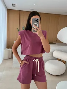 Mauve two-piece lounge set featuring a padded shoulder crop top and shorts