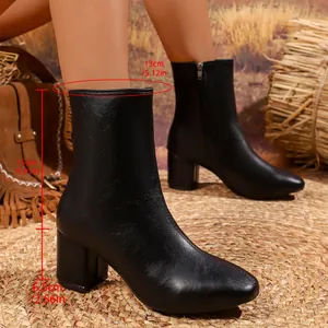 Stylish black leather ankle boots for women featuring a block heel and side zipper closure.