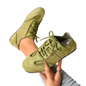 Stylish light green suede casual flat sneakers for women presented on a white background