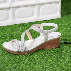Detailed view of silver Bohemian braided wedge sandals with 5cm heel height measurement
