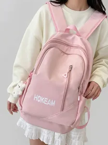 Vue arrière détaillée d'un sac à dos rose élégant à grande capacité pour étudiantes avec ours