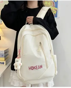 Cream white large capacity backpack with cute bear pendant for students
