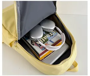 Close-up of a yellow laptop backpack interior showing its spacious storage capacity
