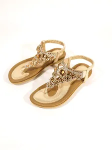 Elegant gold flat sandals with exquisite floral rhinestone and gem detailing for beach wear
