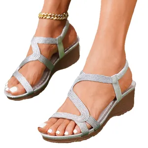 Stylish bohemian silver wedge sandals with metallic woven straps for summer beach wear