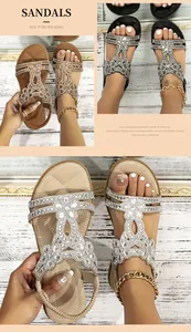 Detailed view of bohemian flat sandals with sparkling rhinestone flower design