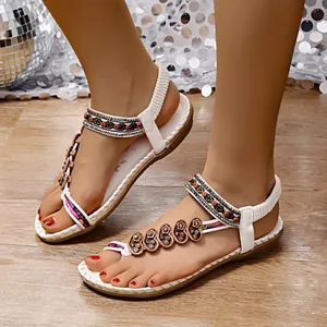 White Bohemian ethnic flat thong sandals with colorful beads and flower sequins.