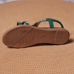 Bohemian flat green sandals for women featuring sparkling rhinestones and floral patterns
