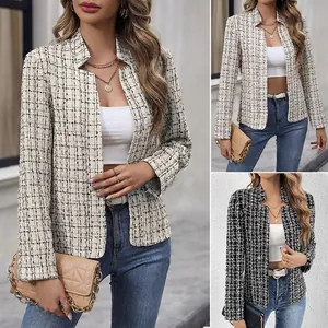 Detail view of women's elegant tweed plaid jacket with stand collar and long sleeves.