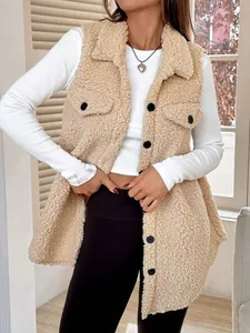 Detail of beige faux shearling vest with lapel and buttoned chest pockets.