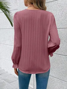 Back detail view showing the elegant pleated texture of this mauve long sleeve V-neck blouse