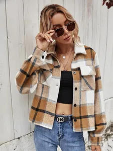 Detail view of a stylish brown plaid lapel button-down jacket for women