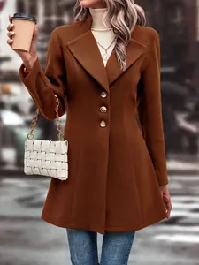 Close-up detail of a brown wool coat with lapel collar and a stylish skater silhouette