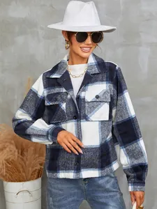 Detail view of women's blue and white plaid flannel jacket with lapel and pockets