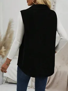 Back view of a black corduroy lapel vest for women styled with a white ribbed sweater