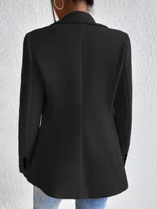 Detailed back view of an elegant black slim-fit wool blazer for professional women
