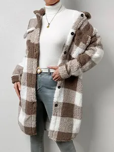Detailed view of the soft texture on a stylish brown and white plaid plush coat
