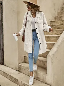 Close-up detail of women's long sherpa coat with lapel and buttons in street setting