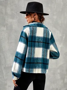 Detailed back view of a stylish teal and white plaid wool-like cropped jacket for women