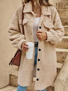 Detailed close-up view of women's beige long teddy fleece coat with button-up front