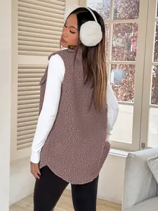 Back view of a mauve oversized teddy fleece vest for women shown in a cozy winter outfit