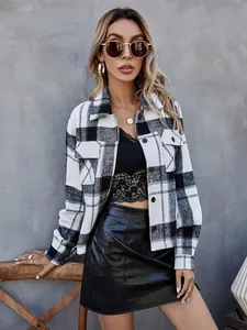 Detailed view of women's black and white plaid wool jacket with single-breasted buttons