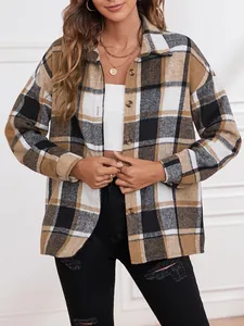 Detailed view of women's brown and white plaid wool-blend shacket with lapel and buttons