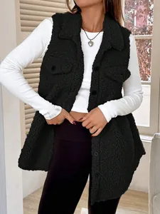 Close-up of black fleece vest showing soft fuzzy texture and lapel button details