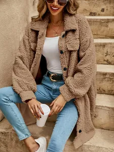 Detail of cozy brown teddy coat with oversized lapel and front buttons