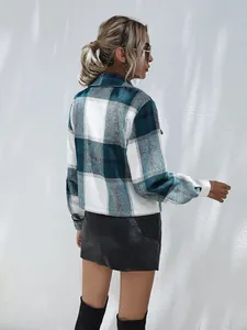 Detailed back view of a stylish women's teal and white plaid shirt jacket outerwear