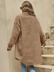 Detailed back view of a long oversized tan fleece teddy coat featuring a thick warm texture.