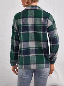 Detailed back view of a cozy green and navy plaid flannel jacket with lapel collar