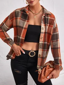 Detail view of women's orange and brown plaid wool blend lapel button-down jacket