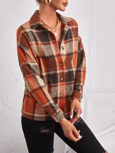 Detailed view of women's autumn plaid wool shacket with lapel and button-down front