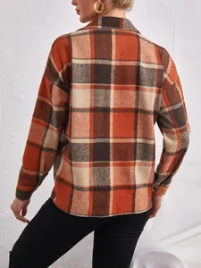 Back view of a vintage orange and brown plaid wool blend shirt jacket for women