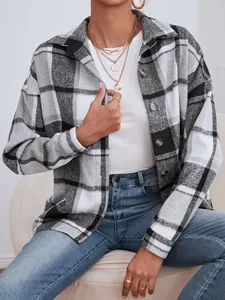Detailed view of a stylish black and white plaid wool shacket for women in autumn