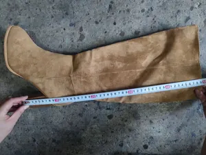 Macro detail view showing the 50cm shaft length measurement of suede over-the-knee boots.