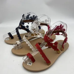 Women's lace toe-ring flat sandals in black, white, and red for beach holiday wear