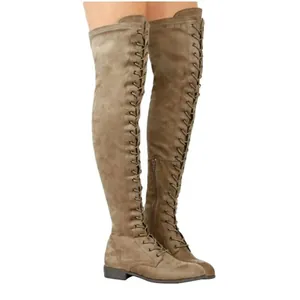 Detailed side view of stylish olive green suede lace-up over-the-knee flat boots for women