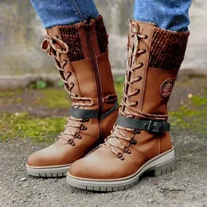Close-up of brown lace-up mid-calf knight boots featuring knit collars and buckle straps