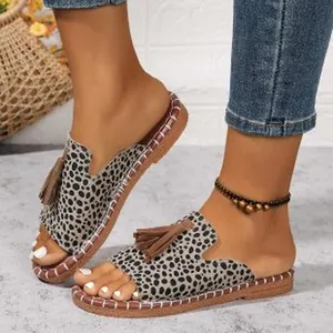 Leopard print open-toe flat sandals with brown tassel detail and braided sole for women