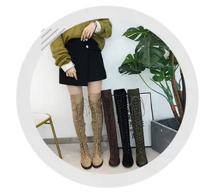 Detail view of stylish lace-up over-the-knee flat boots in multiple colors